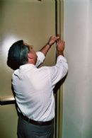 Affixing the Social Hall mezuzah Affixing the Social Hall mezuzah