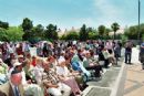Despite the heat, everyone gathered outside for the ribbon cutting Despite the heat, everyone gathered outside for the ribbon cutting